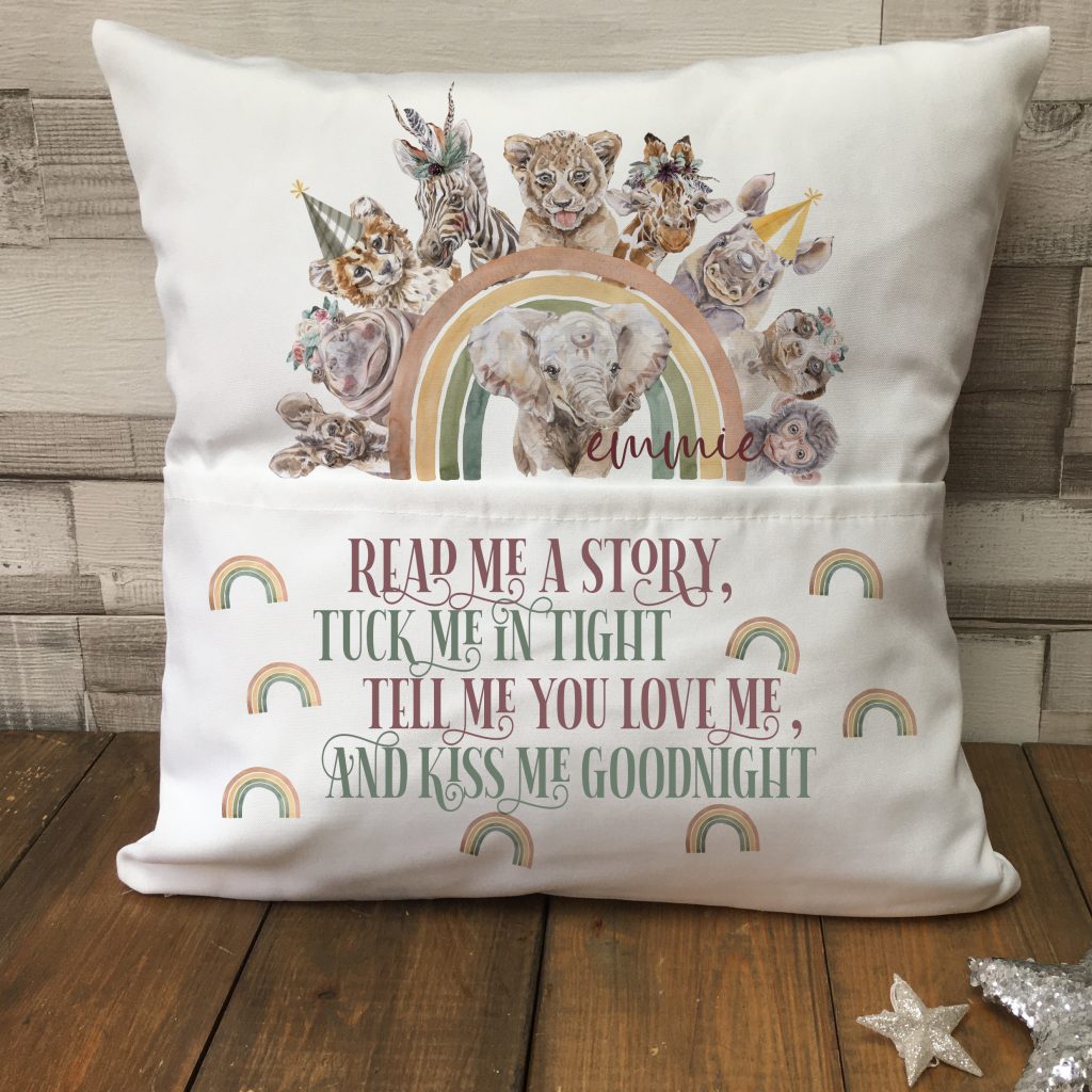 Kids reading cushion featuring a rainbow design, animals on a white background