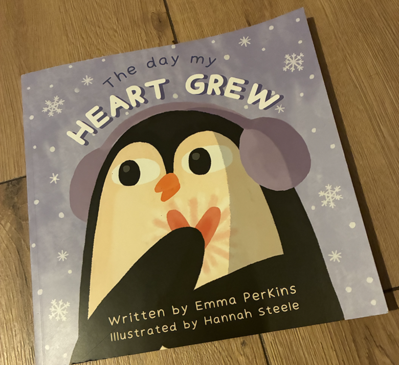 Front cover of The Day My Heart Grew by Emily Perkins featuring the illustration of a penguin