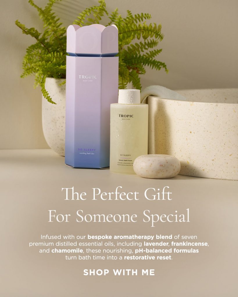 Tropics So Sleepy Bath Duo gift set pictured in front of a plant and beside a cream-coloured sink