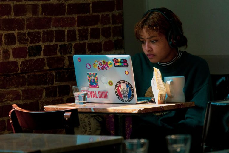 Teenager looking at their laptop screen