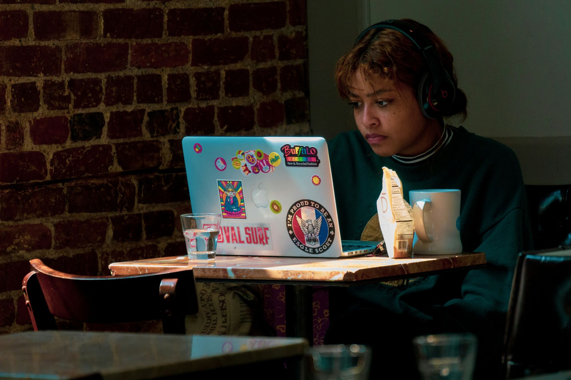Teenager looking at their laptop screen